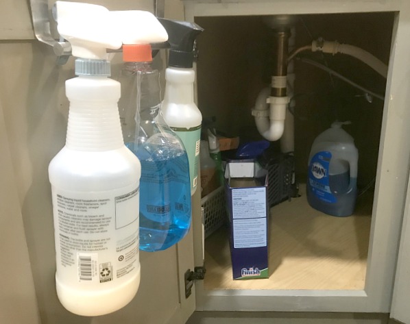 Under sink bottle hanger