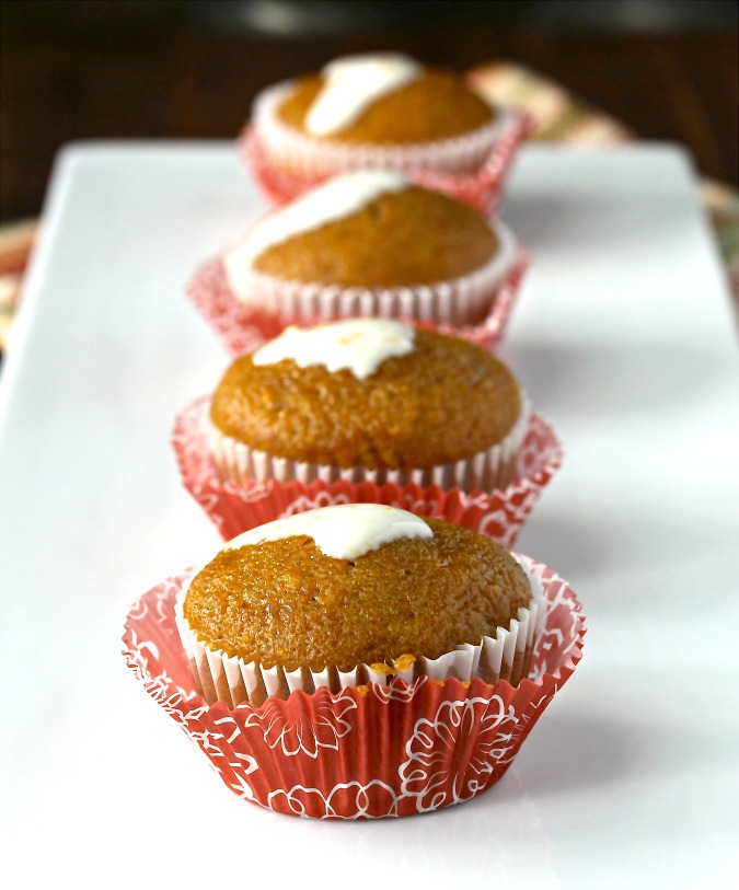 These butternut squash muffins are loaded with grated butternut squash, and are flavored with cinnamon, brown sugar, and pecans. They are drizzled with a very grown up vanilla, citrus zest, and sour cream topping when served.