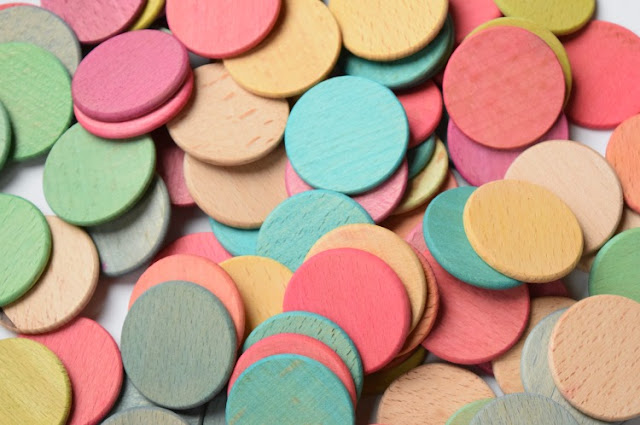 Dyed colored wooden discs for learning or playing Dyed colored wooden discs for learning or playing