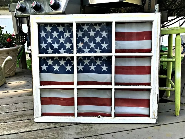 American flag on a chippy window
