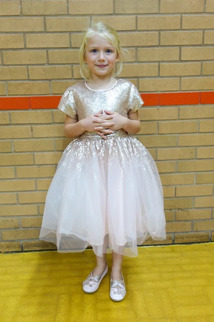 My daughter at her 6th birthday party wearing a pale pink sequin mesh dress from Little Dickens & Jones and shoes from H&M