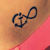 Infinity couple tattoo on belly