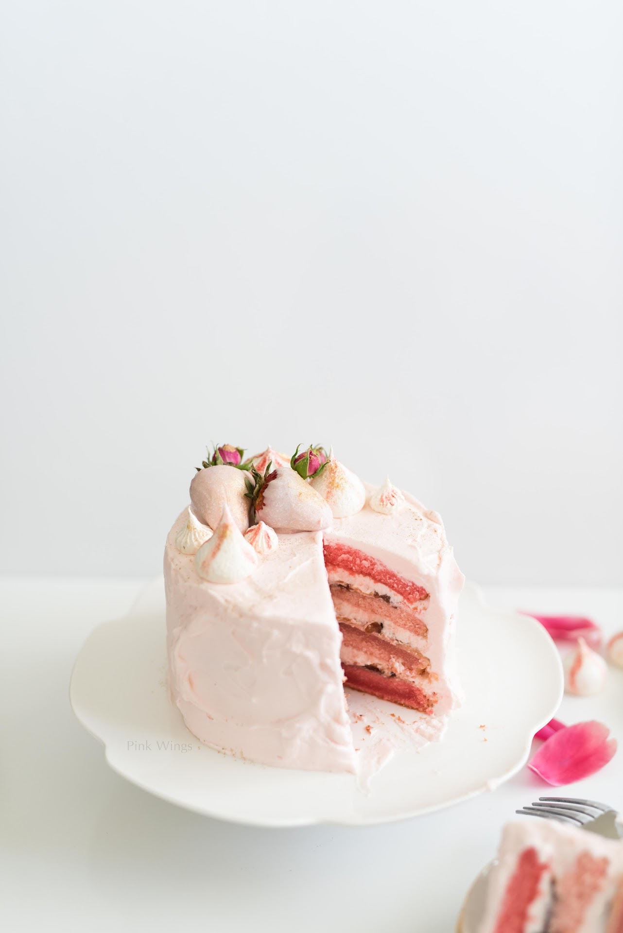 This Strawberry Cake Recipe is perfect to celebrate any special occasion.  The homemade frosting is delicious. Pin it now and bake it later! 