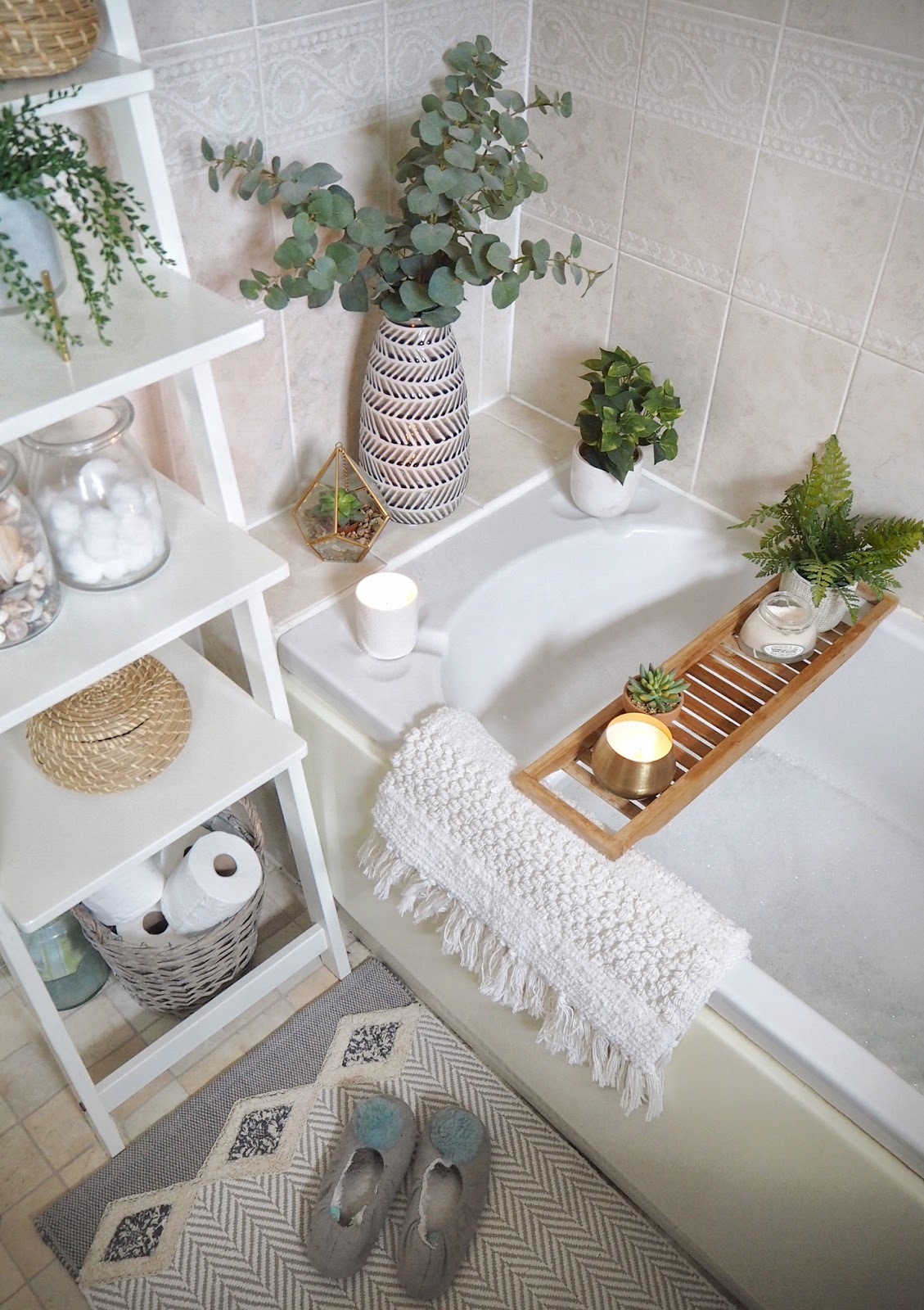 How to give your small bathroom a quick, simple and budget-friendly makeover, using accessories only. Featuring tips on how to maximise space, trick the eye into making the room look bigger, incorporate storage into your interior design, and how small can still be stylish. Artificial plants and greenery add a natural touch without the commitment of live plants, and a bath shelf makes more of the space.