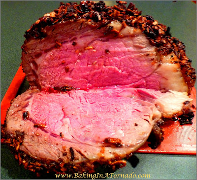 Crusted Prime Rib, tender and flavorful, rubbed and roasted for a special occasion dinner | Recipe developed by www.BakingInATornado.com | #recipe #beef #dinner