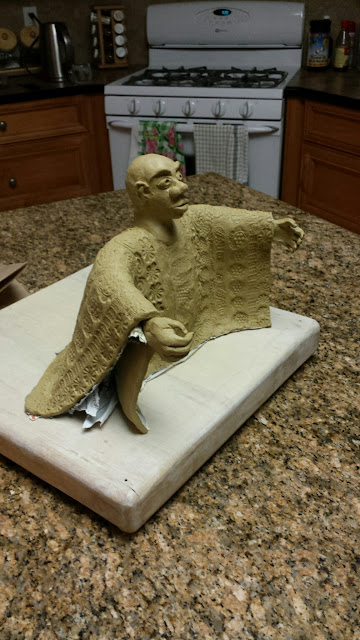 Clay sculpture of an African man, in progress, by Lily L.