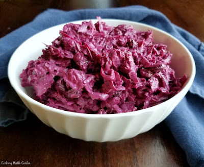 Russian Style Beet Salad is the perfect combination of creamy and crunchy, savory and sweet. You just have to try it! bowl piled high with sour cream beat salad
