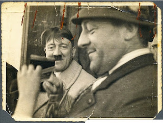 Adolf Hitler smiling worldwartwo.filminspector.com