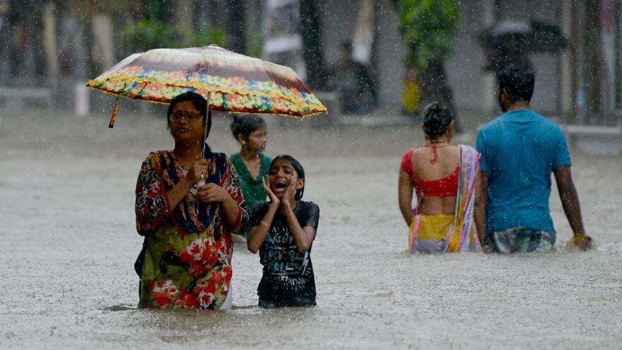 18 Devastating Pictures Of The Flooding In South Asia That Will Shock You - Indians Wade Through A Flooded Street During Heavy Rain Showers In Mumbai
