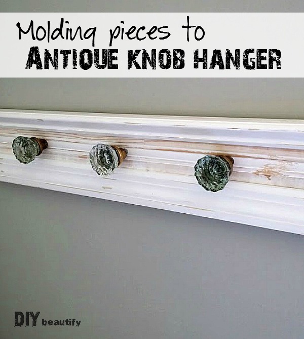 I turned a few pieces of molding and some antique glass door knobs into a stunning door knob hanger. Get the full tutorial at DIY beautify.