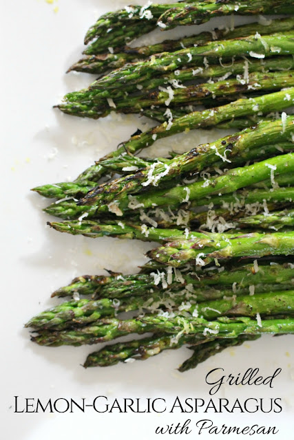 Grilled lemon-garlic asparagus with Parmesan cheese. Grilled asparagus.