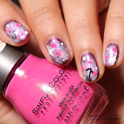 DIY Valentine's Day-inspired pink galaxy nails featuring hearts