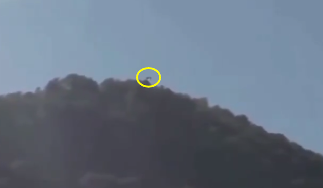 Here is the UFO coming around the corner of the top of the mountain.