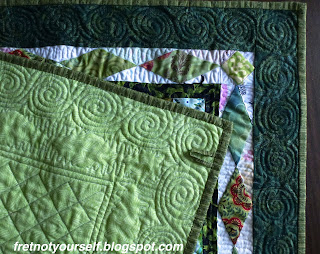 Quilting details on back of Scrappy Trip Around the World quilt