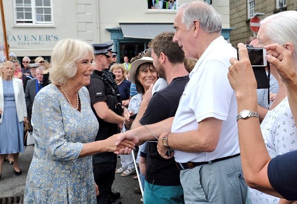 The Duchess of Cornwall wears a pale blue floral midi dress for the visit. Prince Charles, Prince Willaim, Prince Harry, Meghan Markle, kate Middleton