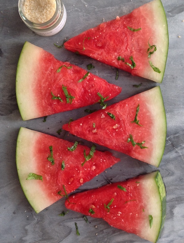 watermelon slices with sprinkles of Thai Ginger Lime Sea Salt with chiffonades of basil