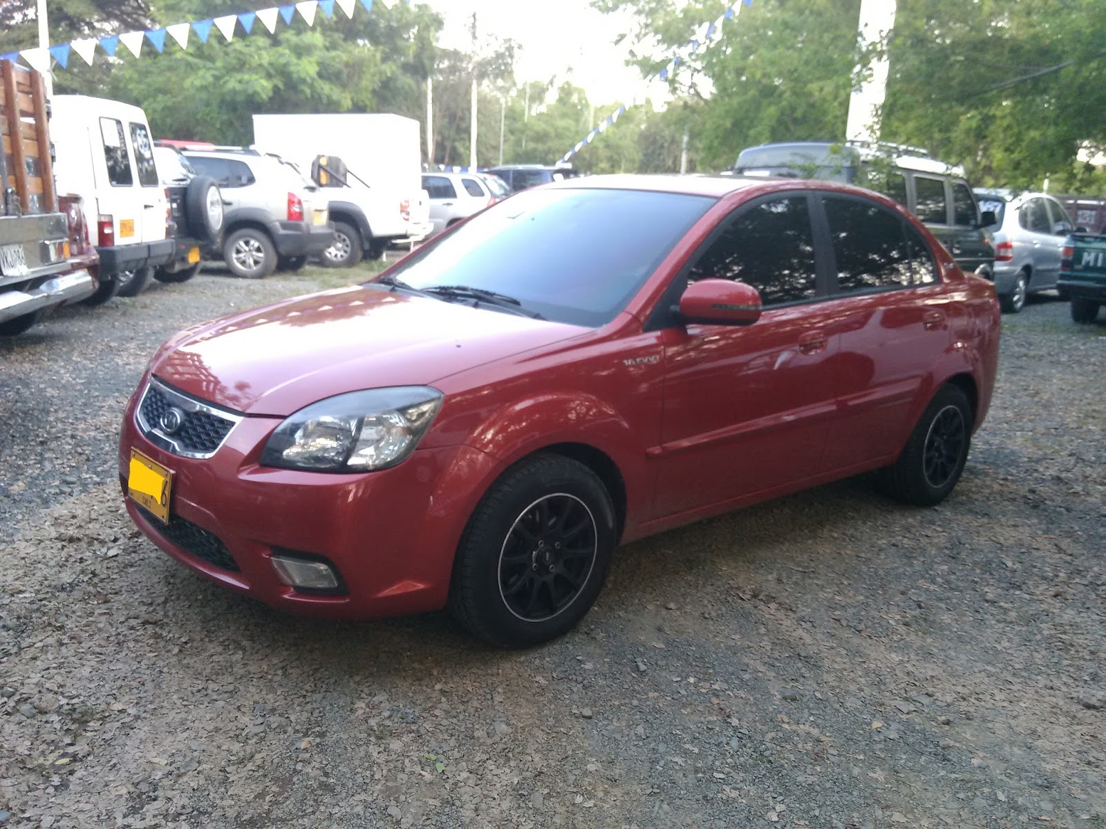 KIA RIO XCITE SPORT 2010 ROJO