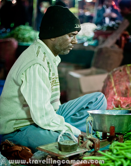 During Christmas vacations, I was in Chandigarh and was staying with Naresh at Mohali. So on thursday, we visited one of the vegetable market at Phase-3B2, mohali and found this little interesting... Let's check out this Photo Journey from this weekly Vegetable Market...Clicking photographs in such markets is not a usual thing and at times, vegetable vendors don't like (which can be interpreted from their expressions.) So we have clicked photographs of shops/kiosks, where we bought something.In most of the big cities/towns of India, there is a trend of weekly vegetable markets. At some places, farmers from surrounding areas come with fresh vegetables to a common ground. While in cities  around Capital region, vegetables vendors come up with various vegetable options picked from main store.In cities like Mohali, Chandigarh are closer to agricultural regions, so have an advantage of accessing fresh vegetables and fruits. In fact, lot of local stuff is also available quite easily...It was wonderful experience to roam around a place with all fresh vegetables, fruits and other local stuff. People from villages calling the customers with extreme humbleness and many times, no need of negotiations. They sell vegetables, fruits, sugarcane etc at very reasonable rates. Most of the vendors deal only in selected items. For example, vegetable vendor in this photograph is only selling potatoes and peas.Colorful vegetables lying across the rows in this market @ Mohali, Punjab, India.Freshness of these vegetables or fruits, at times, compel to overbuy due to cheaper rates. So it's always important to know the need, before heading towards these markets. It's always tempting to stop by every kiosk and ask for rates and fill the bags :) ... I know it's not possible to estimate the amount and type of vegetables/fruits required for next few days, but it becomes important when you are shopping at these moving markets and not supermarkets around your house.Please have a look at http://spiceflair.com/the-farmers-market-of-india-sabzi-mandi/This link shares an interesting experience of Sabzimandi and memories from childhood of author, who has recommended some of the tips for shopping in moving Sabzimandi around your place'Gurh' - Almost all moving vegetable markets will have this stuff, which is made up of sugarcane and mostly processed locally by farmers. I recommend to never visit the place where it's processed, because that may lead you to not use this stuff :) ... In fact, same is the case with Sugar Factories. In that case, even you need not to go inside the factory.In most of the planned cities, appropriate authorities facilitate these markets. Things like benches on rent are provided to farmers, so that they need not to worry about the such heavy things. Apart from this, authorities need to take care of providing appropriate space for farmers and cleaning of the same space next day. So farmers come up with stuff they want to sell, some small equipments for lighting the space and covers-wraps in case of rains etc.Bananas... Almost every seasonal vegetable and fruits can be found in these markets. Apples, Bananas, Grapes, Pomegranates in fruits and vegetables like -  Beetroot, Bitter Gourd, Bottle Gourd, Brinjal, Cabbage, capsicum, Carrot, Cauliflower, Coriander leaves, Corn, Cucumber, Curry leaves, French Beans, Fenugreek leaves, Garlic, Ginger, gooseberry, Green Mustard, Green Peas, Green Onion, Lady Finger,Lemon, Maize, Mint, Mushroom, Onion etc...Here is a nice link with some of the names of vegetables in English and translation in Hindi or what we call them in India - http://www.syvum.com/recipes/indian/glossv1.htmlOne of the vegetable only selling things like Red and Green chillies, gooseberry & green chickpea etc.Sparkling lights around colorful vegetables @ Moving Sabzimandi, Mohali, Punjab, India !!For health conscious people, there is lot of information available on web. Like healthiest vegetable for winters etc.. One of the similar link can be seen at http://eatdrinkbetter.com/2008/12/12/seasonal-eats-5-best-winter-vegetableSabzimandi is also a good place to look for daily-use stuff in some of the shops around the main market. These shops are extremely useful at times...Not only daily use stuff, but cloths, bed-sheet and other stuff is also sold. I am not sure how popular such shops are but I always these them around moving Sabzimandi... I was standing at this point for 10 minutes, didn't see even a single customer for him. Hope he makes good money during the time he spent in chilling winters.As a bachelor, I hardly go to these markets. In Chandigarh, I got this opportunity to visit this Sabzimandi with my friend. Hope to visit the Monday Vegetable Market in Noida as well. It's very close to my office :) ... Hope to share another Photo Journey on Noida Sabzimandi soon... 