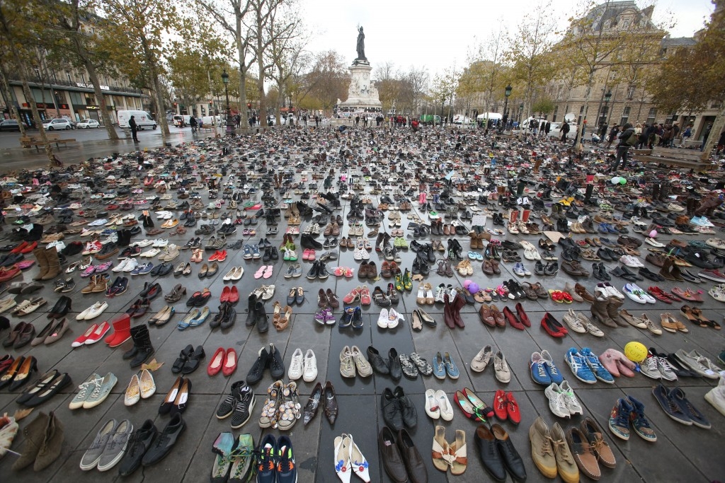 70 Of The Most Touching Photos Taken In 2015 - Shoes are left in the place of climate activists after a COP21 march in Paris was cancelled for security reasons.