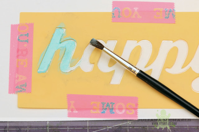 Tutorial for creating a handmade scrapbook page title using a stencil, modeling paste and acrylic paint by Juliana Michaels featuring Jillibean Soup Stencils and Happy Hues Paint
