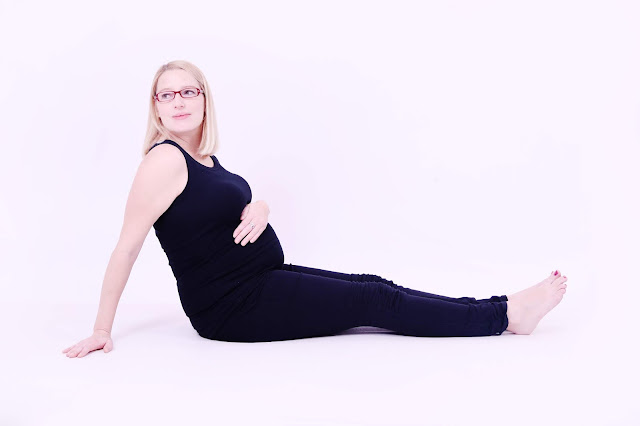 36 week pregnant woman sitting on the floor