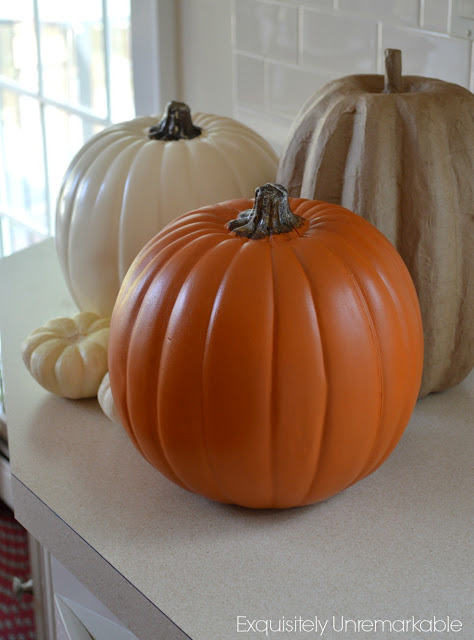 Faux pumpkins on counter