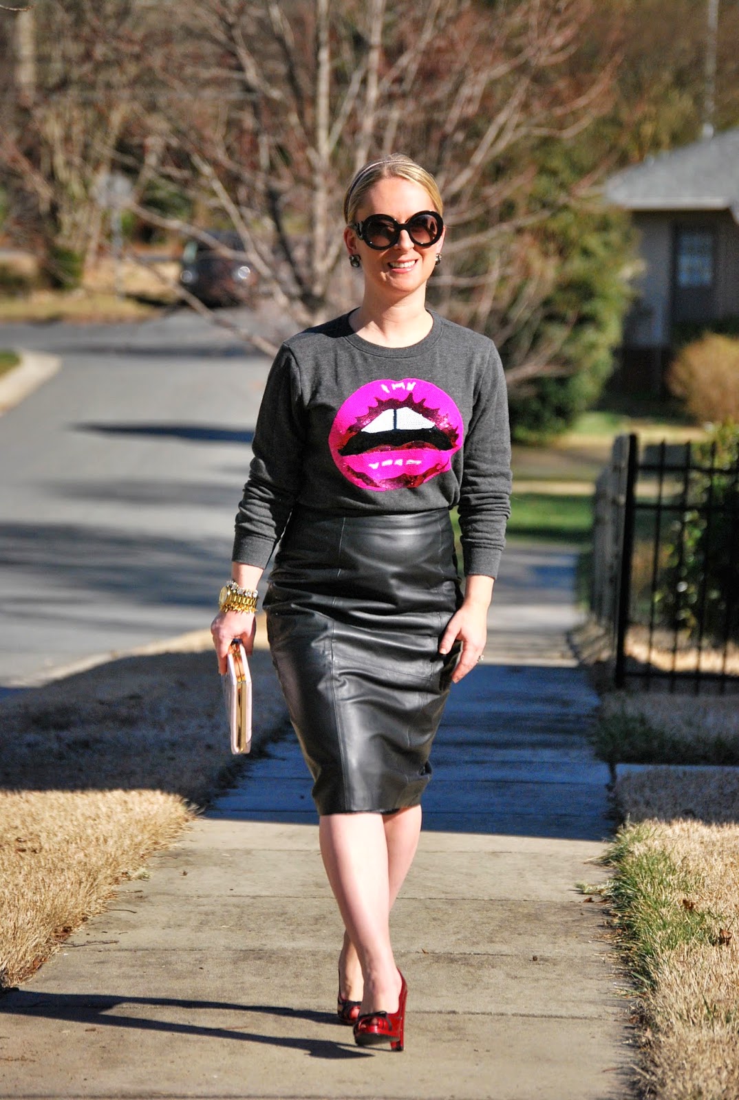 leather pencil skirt, pink pumps, Kate Spade book clutch