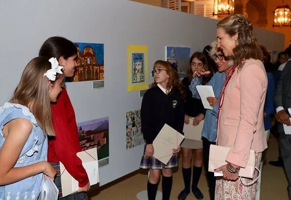 Infanta Elena of Spain wore Boss pumps and Mango pink jacket and Zara print trousers carried Mango clutch