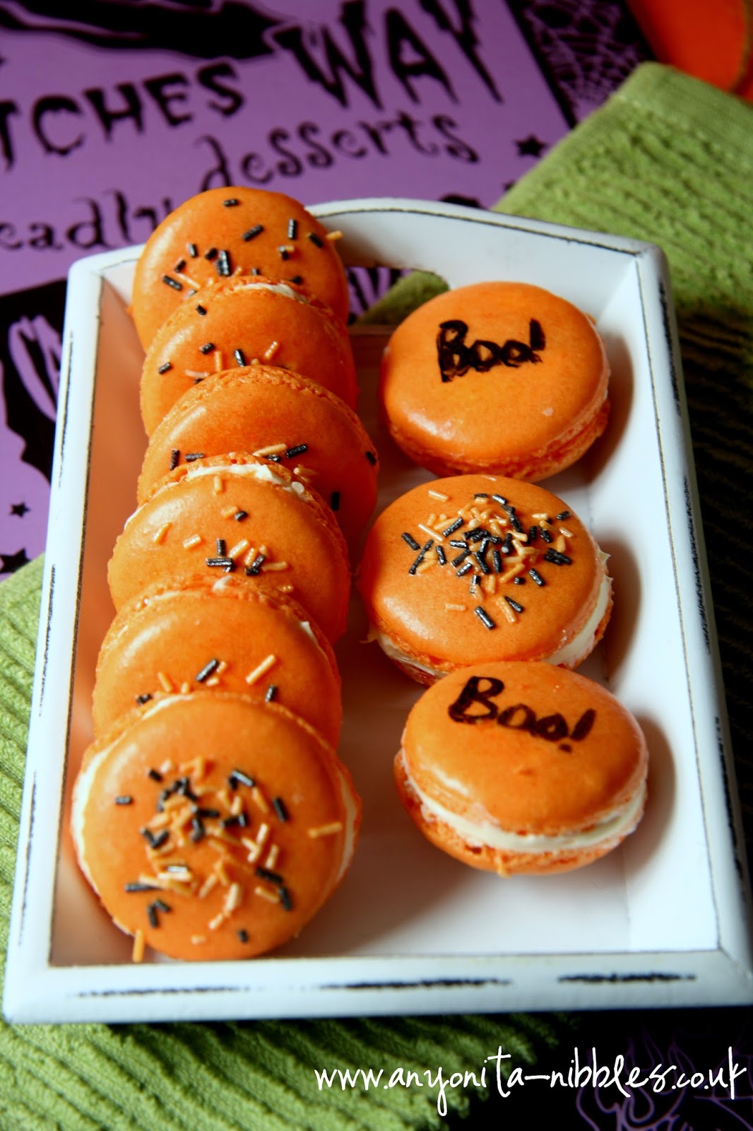 Halloween macarons topped with purple and orange sprinkles from www.anyonita-nibbles.co.uk