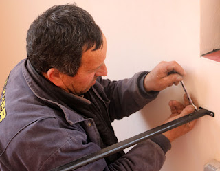 Putting bolts in to secure the frame Putting bolts in to secure the frame