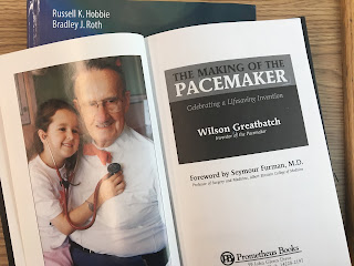 A picture of Wilson Greatbatch, superimposed on Intermediate Physics for Medicine and Biology.