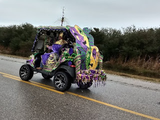 golf cart in Mardi Gras draping and masks