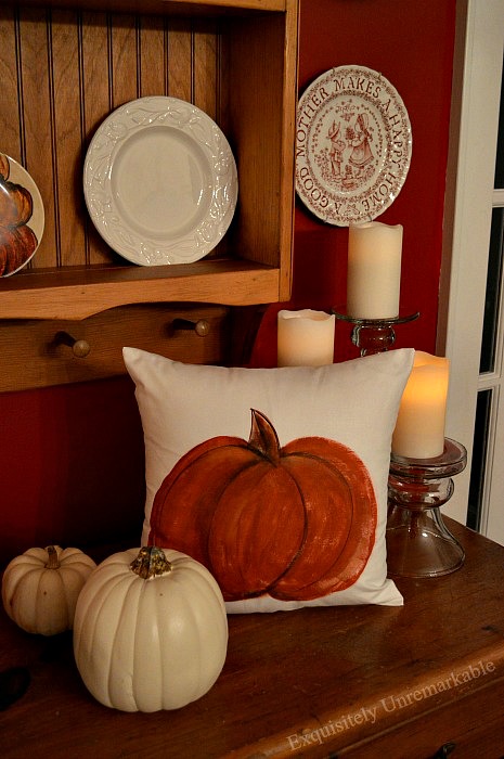 DIY Hand Painted Pumpkin Pillow on a kitchen dresser with fall decor