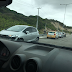 Carro vira e colide em guard rail na Via Costeira
