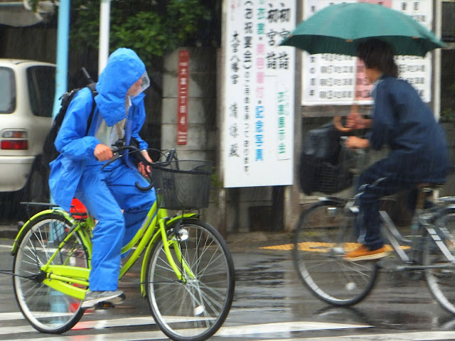 Cyclists battling the elements in Tokyo.