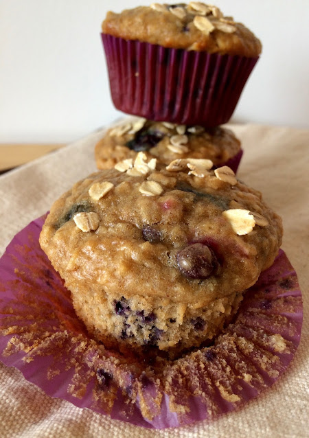 Stack of blueberry oatmeal muffins.