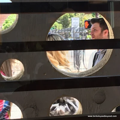 looking out through the "cheeseboard" from Mezzo on Telegraph Avenue in Berkeley, California