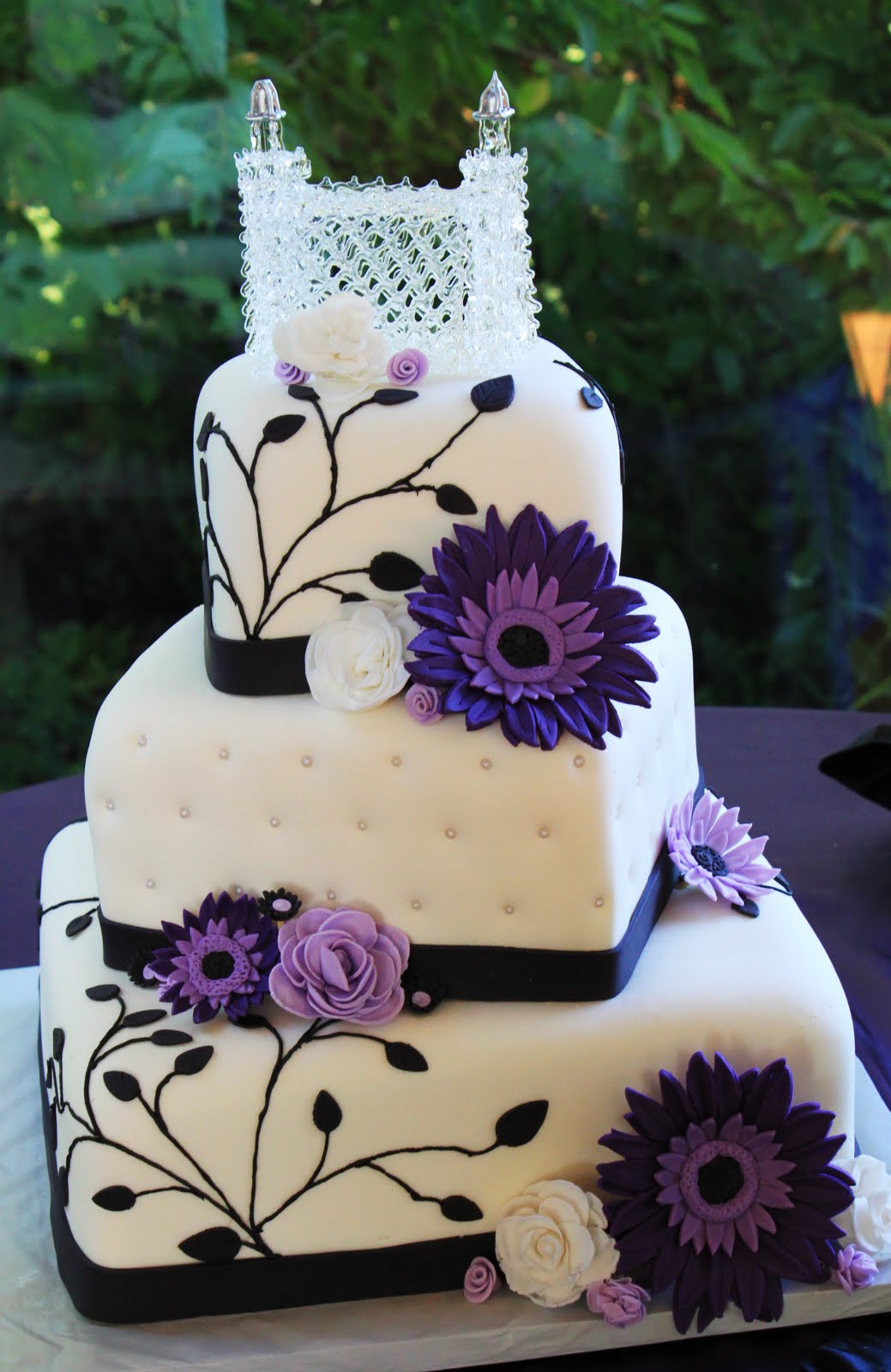Layers of Love Purple Daisies Wedding Cake