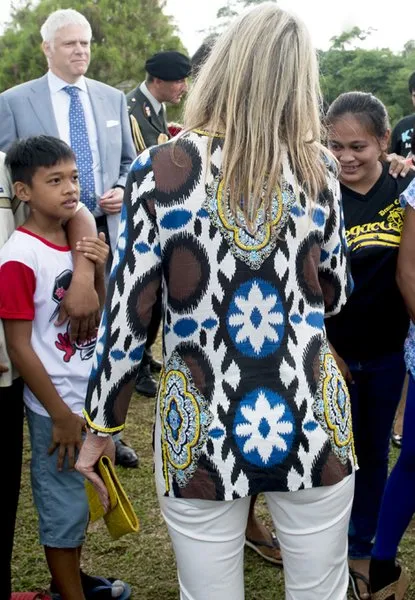 Filipino pineapple growers, during her visit at a Pineapple farm in Tagaytay City, south of Manila, Philippines