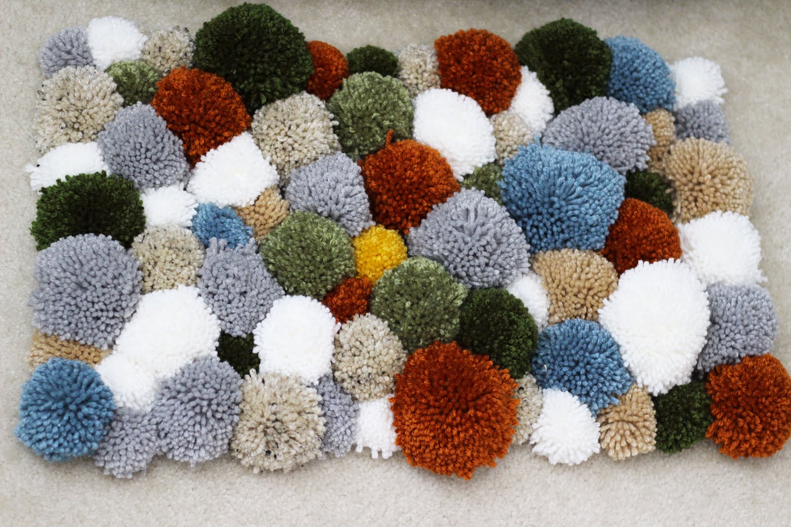 DIY Yarn Pom Pom Rug • Sewrella