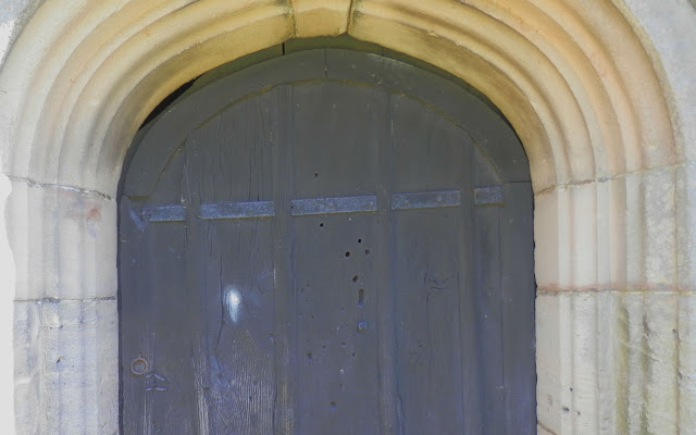 Doors to the tower at St. John The Baptist in Mayfield