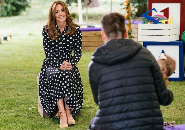 Kate Middleton is wearing a pleated polka-dot crepe shirtdress by Emilia Wickstead, and carina canvas wedge espadrilles from Castaner