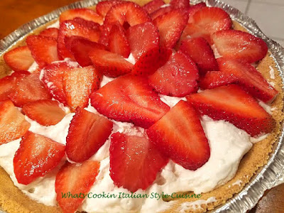 this is a no bake cheesecake with strawberries on top and graham cracker crust