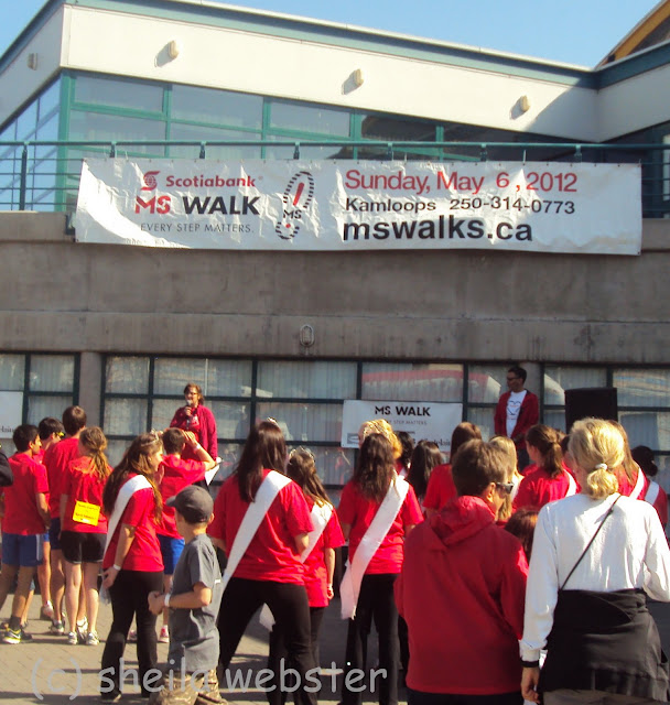 The crowd gathers to hear the appreciation for volunteers and their hard work to make this day a success.