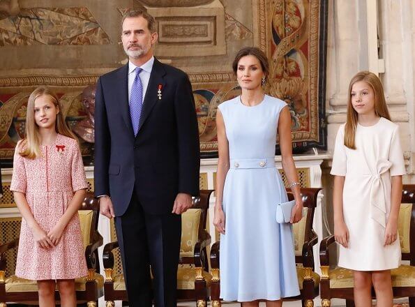 King Felipe, Princess Leonor and Infanta Sofia. Queen Letizia, blue dress, diamond bracelet, and diamond earrings