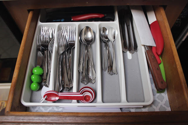 an organized utensil drawer in a kitchen