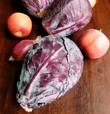 heads of red cabbage, apples and onions heads of red cabbage, apples and onions