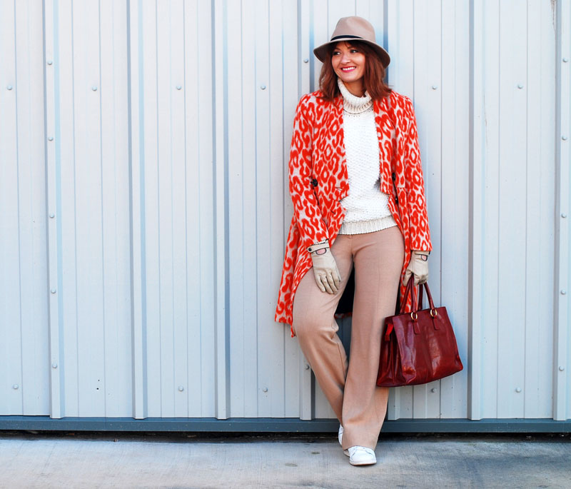 Bold, bright winter outfit: Orange animal print coat chunky white roll neck sweater camel wide leg trousers (pants) white Stan Smiths red tote bag camel felt fedora | Not Dressed As Lamb, over 40 style