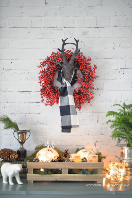 whitewashed brick wallpaper | reindeer head with berry wreath and plaid scarf | Ramblingrenovators.ca