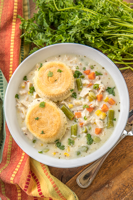Chicken Pot Pie Soup - comfort in a bowl! Quick homemade soup with biscuits baked on top. Chicken, chicken broth, mixed vegetables, seasonings, and refrigerated biscuits. Ready in 30 minutes! Everyone LOVED this soup!!! So easy!! #soup #chicken #onepotmeal #comfortfood Chicken Pot Pie Soup - comfort in a bowl! Quick homemade soup with biscuits baked on top. Chicken, chicken broth, mixed vegetables, seasonings, and refrigerated biscuits. Ready in 30 minutes! Everyone LOVED this soup!!! So easy!! #soup #chicken #onepotmeal #comfortfood